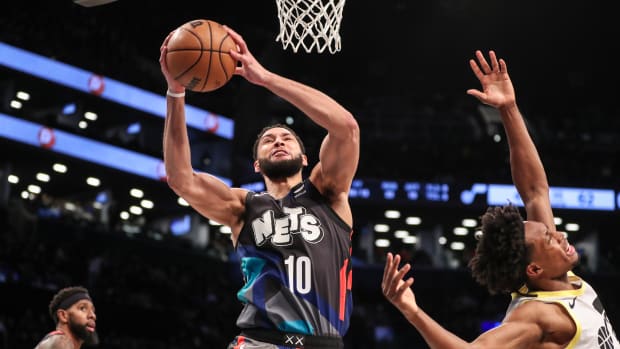 Ben Simmons rises for a dunk
